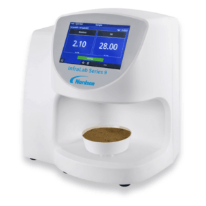 Infralab series 9 moisture analyser testing a bowl of sand