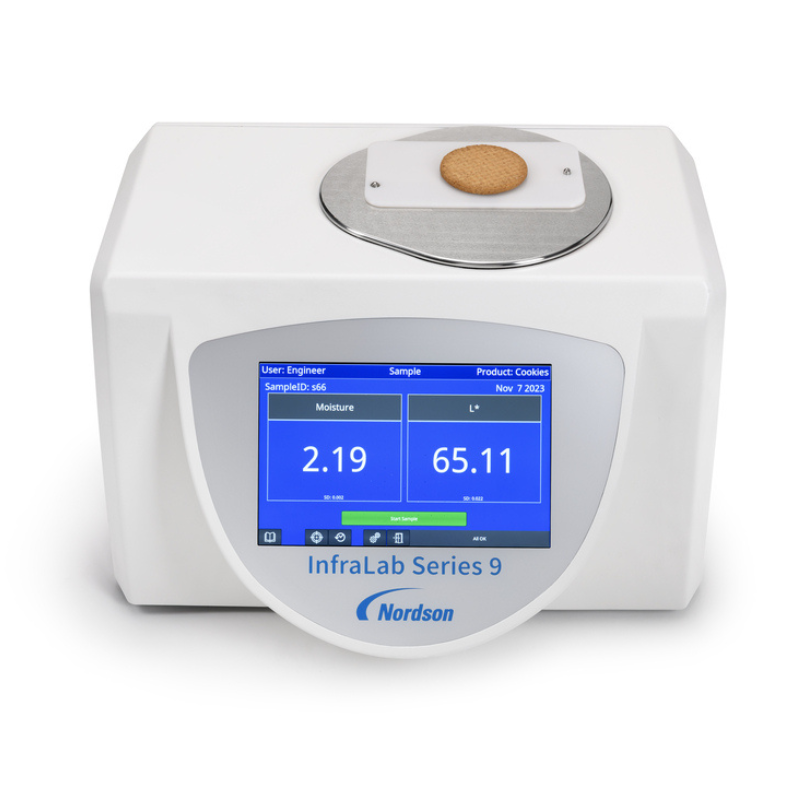 Nordson Infralab Top Loader Analyser with a round biscuit on the analyser